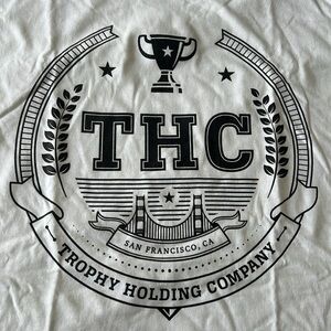 Trophy Holding Co. Vintage Style Logo White Graphic T-Shirt 2XL